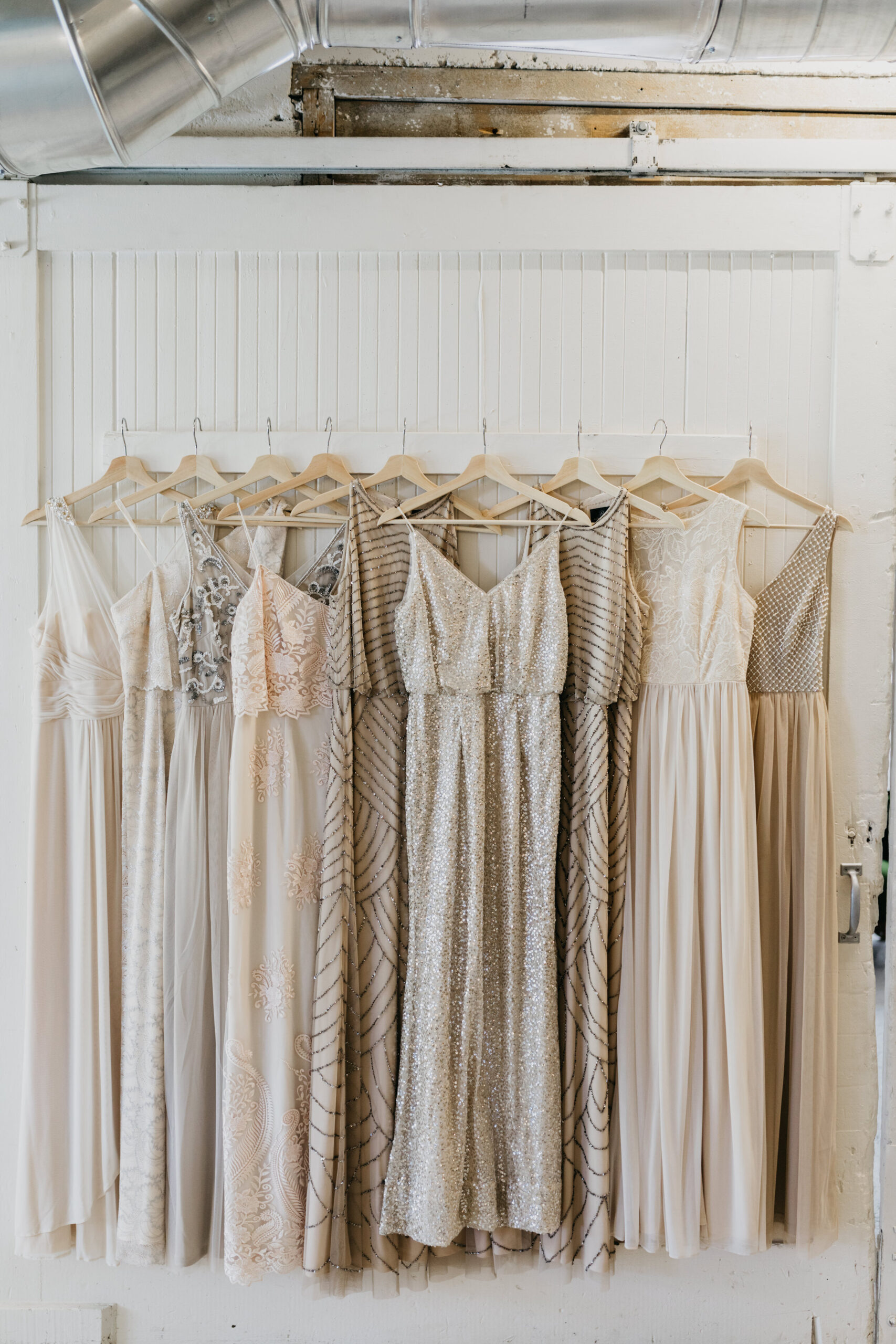 Modern neutral palette: gray, ivory, champagne, taupe, silver bridesmaids dresses.