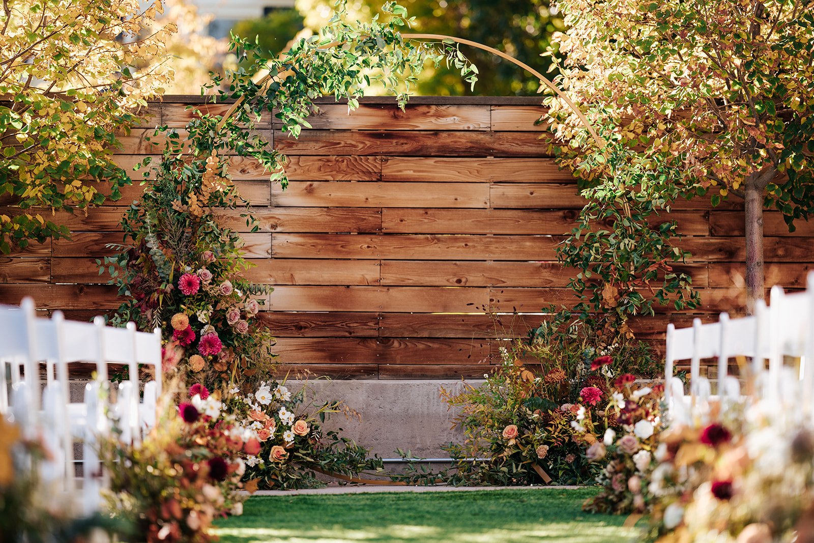 Wedding ceremony arch in courtyard at Colorado fall outdoor wedding at the St Vrain